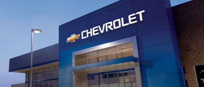 Chevrolet logo and name on modern building.